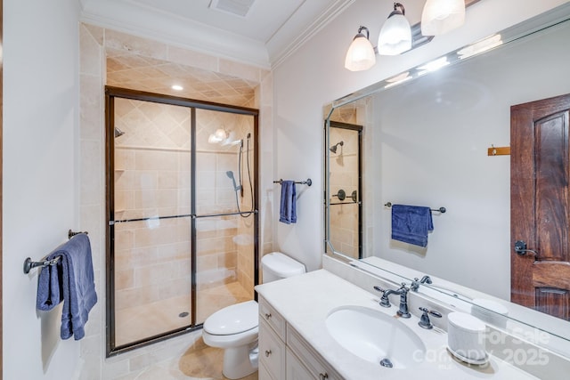 bathroom with vanity, crown molding, toilet, and walk in shower