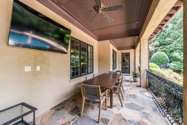 view of patio / terrace with a balcony and ceiling fan