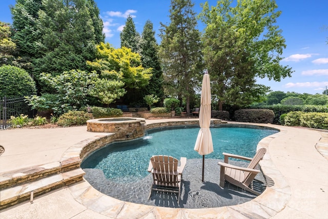 view of pool featuring an in ground hot tub and a patio area