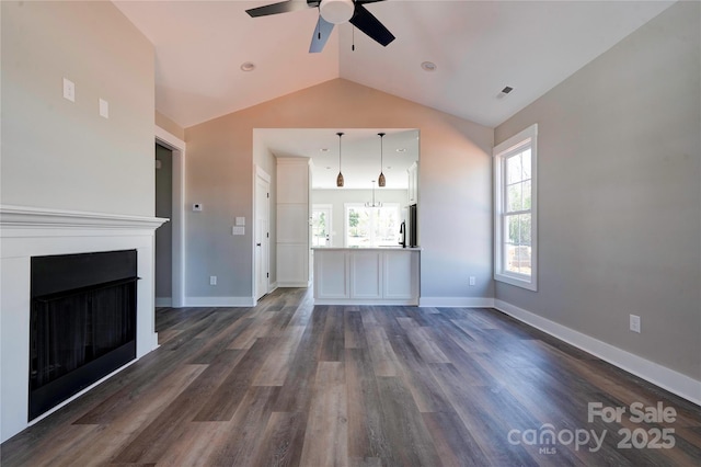 604 E Ridge St, Kings Mountain, NC 28086 - unfurnished living room featuring dark wood finished floors, visible vents, ceiling fan, and vaulted ceiling