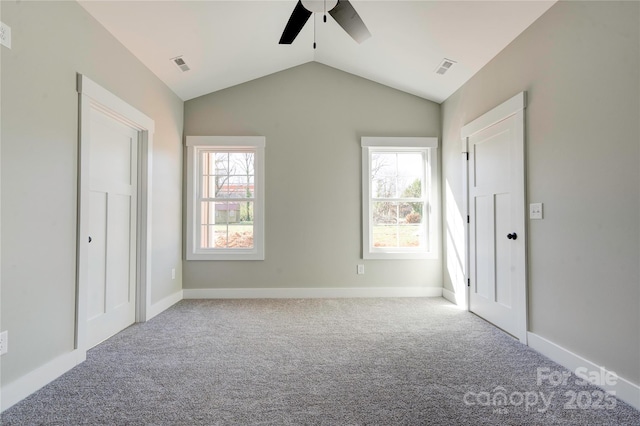 604 E Ridge St, Kings Mountain, NC 28086 - unfurnished bedroom featuring multiple windows, visible vents, carpet flooring, and vaulted ceiling