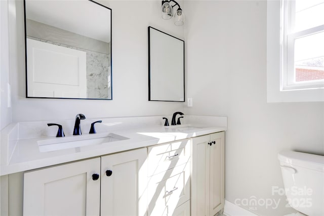 604 E Ridge St, Kings Mountain, NC 28086 - bathroom with double vanity, a sink, and toilet