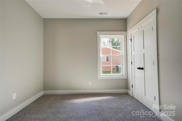 604 E Ridge St, Kings Mountain, NC 28086 - unfurnished bedroom with carpet, baseboards, and visible vents