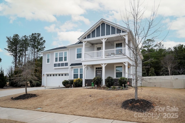 view of front of property featuring a garage and a balcony