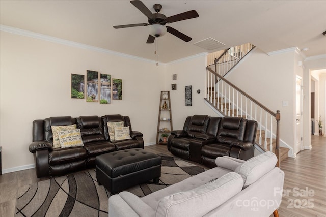 living room with ceiling fan, ornamental molding, and hardwood / wood-style floors