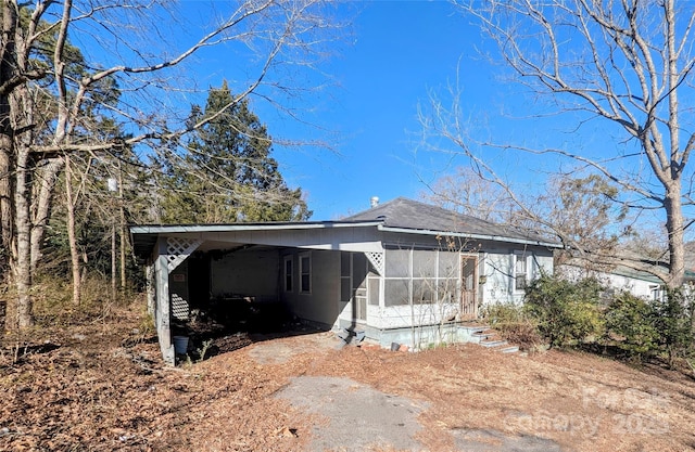 view of front of home with a sunroom