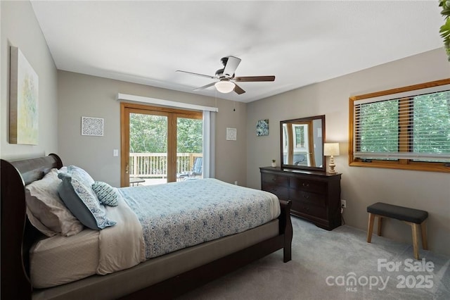 carpeted bedroom with access to exterior and ceiling fan