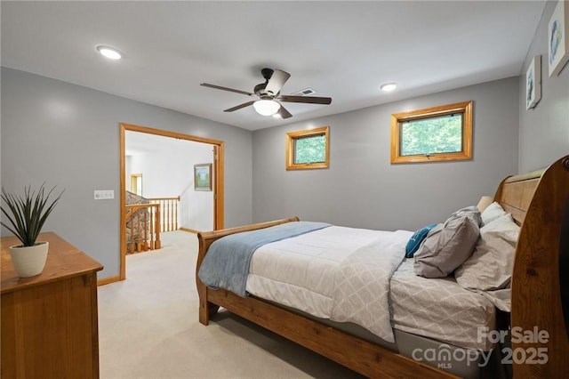 bedroom featuring ceiling fan and light colored carpet