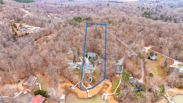 drone / aerial view with a view of trees