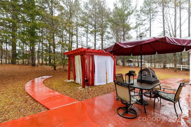 view of patio / terrace featuring a grill and a shed