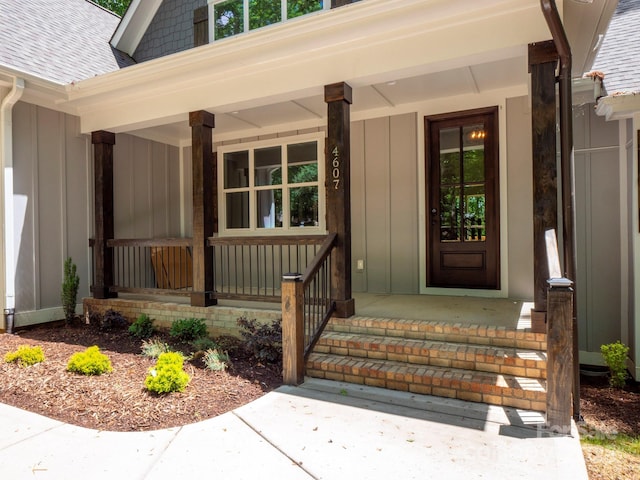 4607 Ferguson Cir, Waxhaw, NC 28173 - doorway to property with a shingled roof, board and batten siding, and covered porch