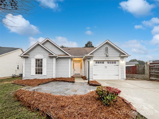 single story home featuring a garage