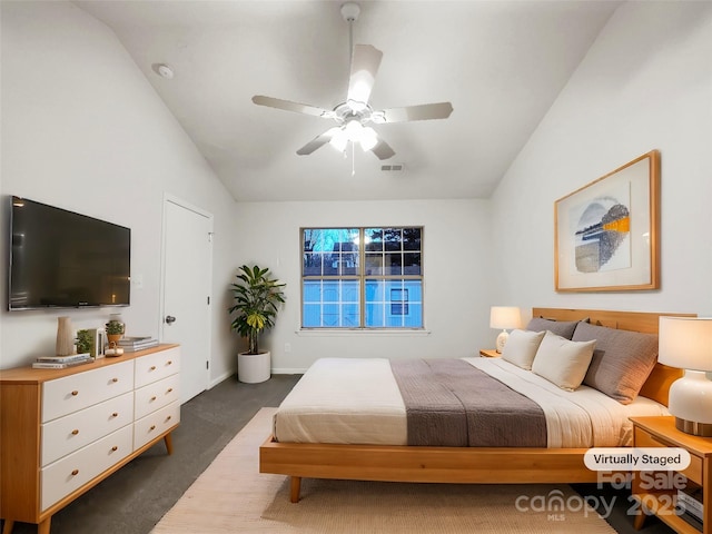 carpeted bedroom with lofted ceiling and ceiling fan