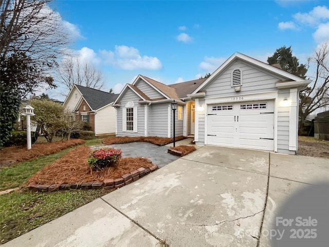 single story home featuring a garage