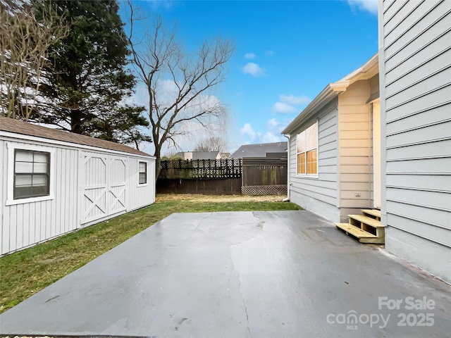 view of patio / terrace featuring a storage unit