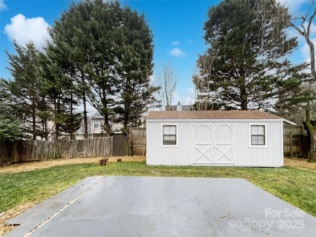 view of outbuilding featuring a lawn