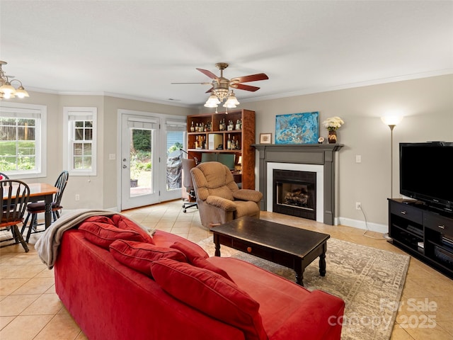 tiled living room featuring crown molding and ceiling fan with notable chandelier