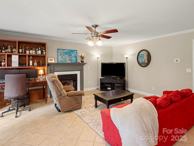 living room with ornamental molding, light tile patterned floors, and ceiling fan