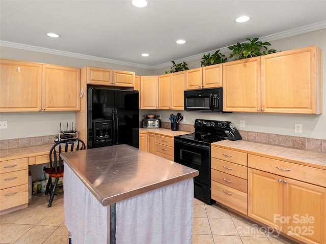 kitchen with built in desk, ornamental molding, black appliances, a kitchen island, and light brown cabinetry