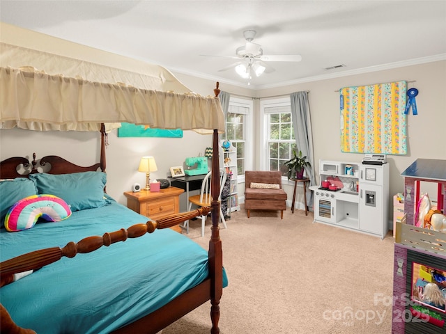 carpeted bedroom with crown molding and ceiling fan