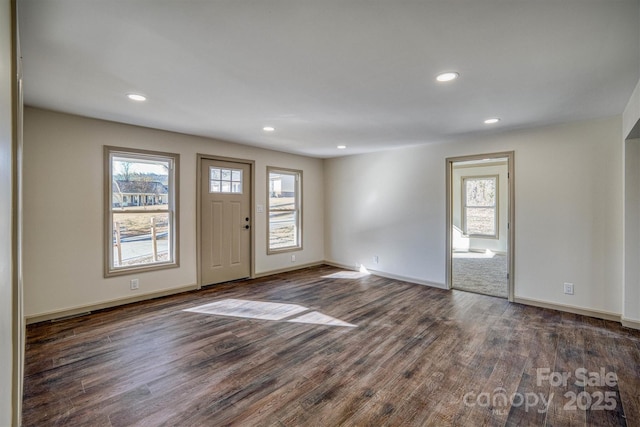 foyer with dark hardwood / wood-style floors