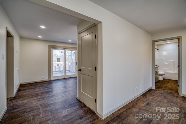 corridor with dark wood-type flooring