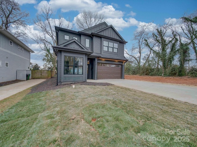 view of front facade featuring a garage and a front lawn