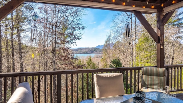 wooden terrace with a water view