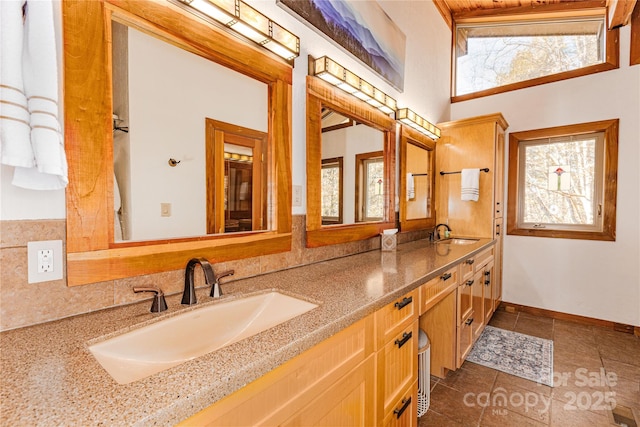 bathroom featuring tile patterned flooring and vanity