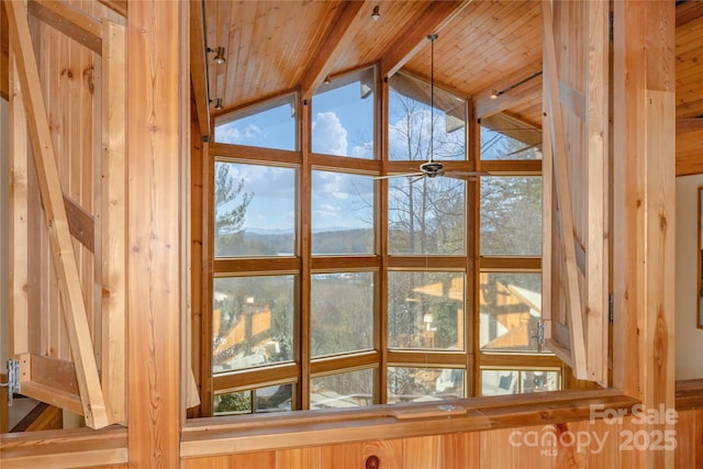 interior details featuring beamed ceiling, a mountain view, and wooden ceiling