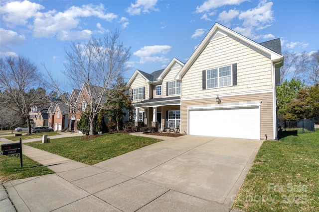 view of front facade featuring a garage and a front yard