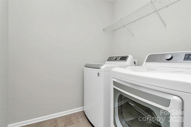 laundry room featuring washing machine and clothes dryer