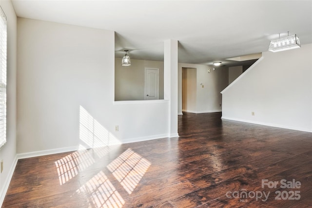 empty room featuring dark wood-type flooring