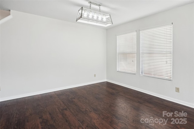 unfurnished room with wood-type flooring