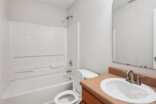 full bathroom featuring shower / tub combination, vanity, and toilet