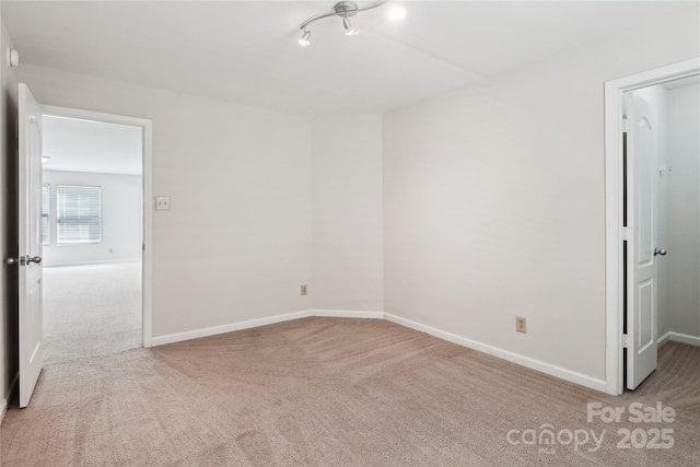 empty room with light colored carpet