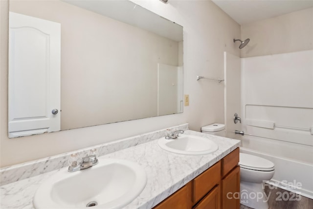 full bathroom with vanity, shower / bathtub combination, and toilet