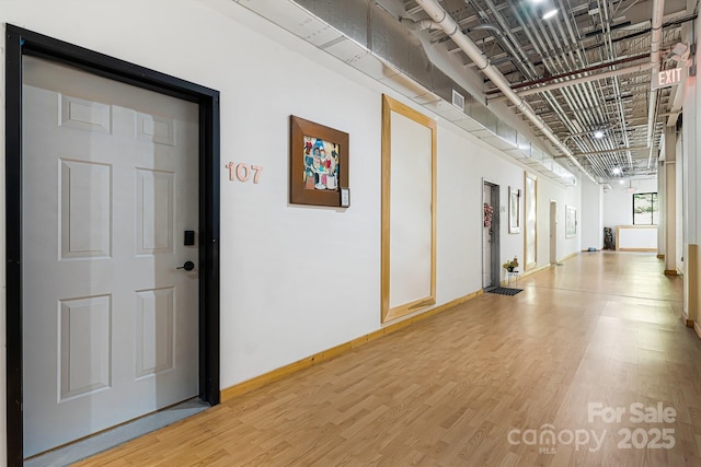 hallway featuring wood-type flooring