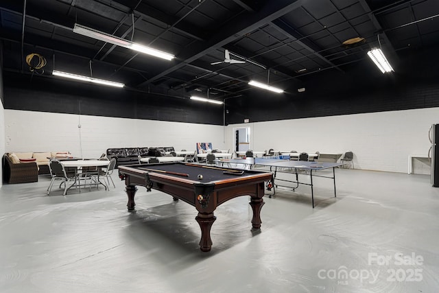 playroom with pool table and concrete flooring