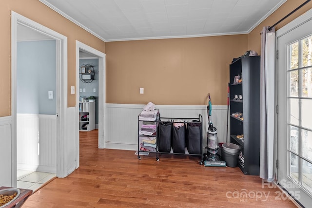 misc room with hardwood / wood-style flooring and ornamental molding