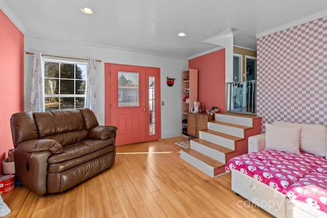 entrance foyer with ornamental molding and wood-type flooring