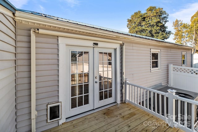 wooden deck featuring french doors