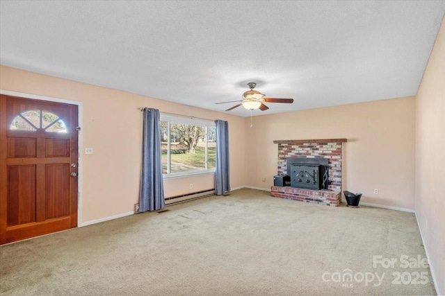 unfurnished living room with a baseboard heating unit, light colored carpet, a textured ceiling, and ceiling fan