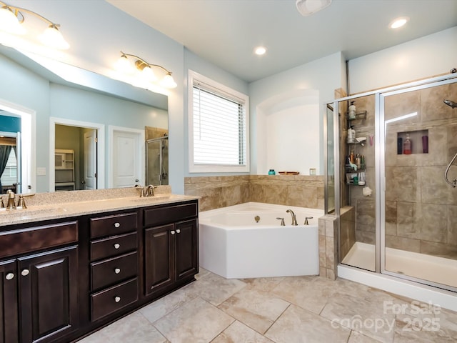 bathroom with vanity, separate shower and tub, and tile patterned flooring