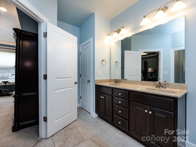 bathroom featuring tile patterned flooring and vanity