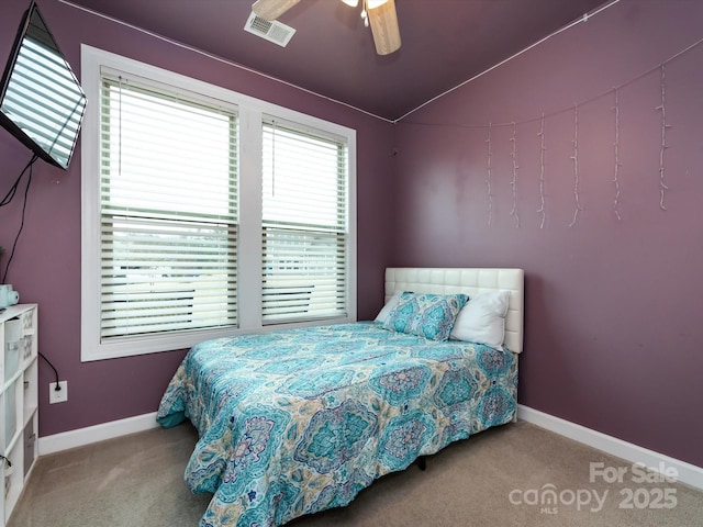 bedroom with ceiling fan, vaulted ceiling, and light carpet