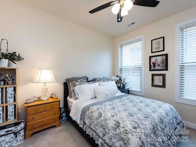 bedroom featuring light carpet and ceiling fan