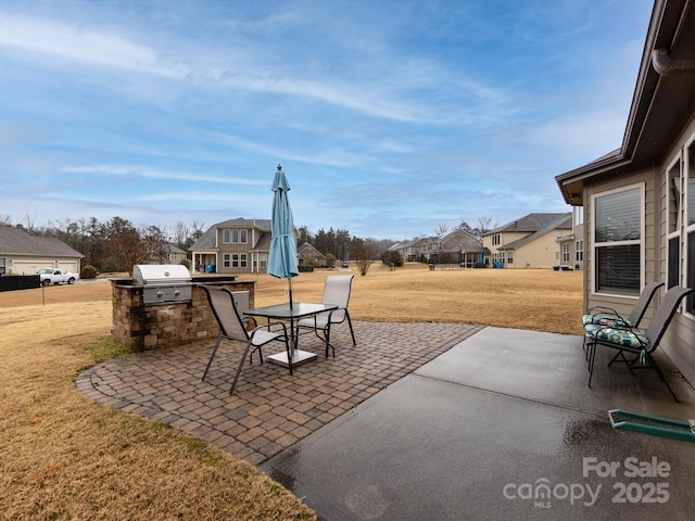 view of patio featuring a grill and exterior kitchen