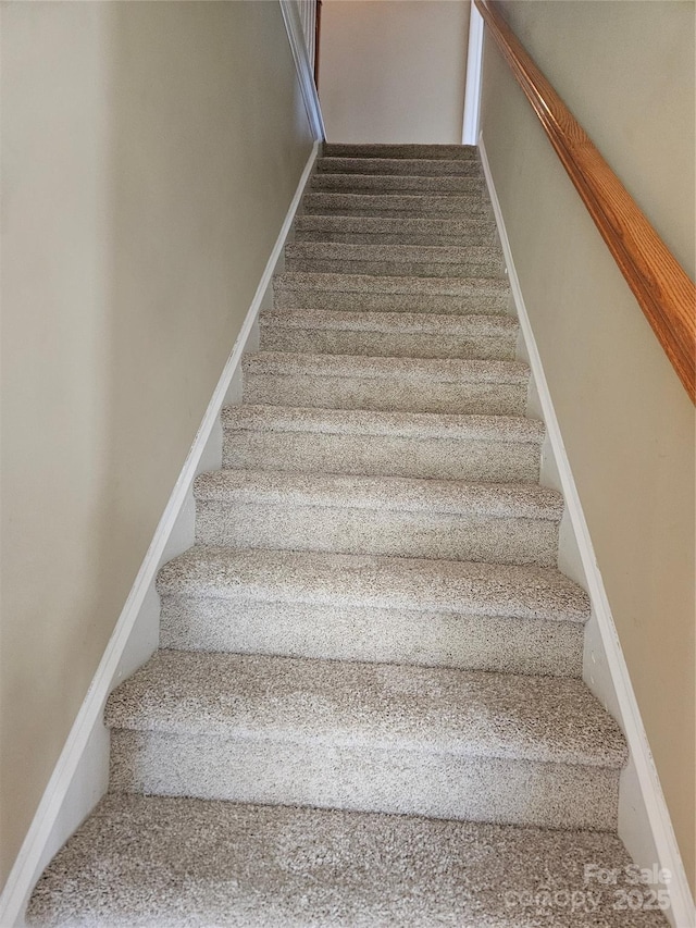 stairs featuring baseboards