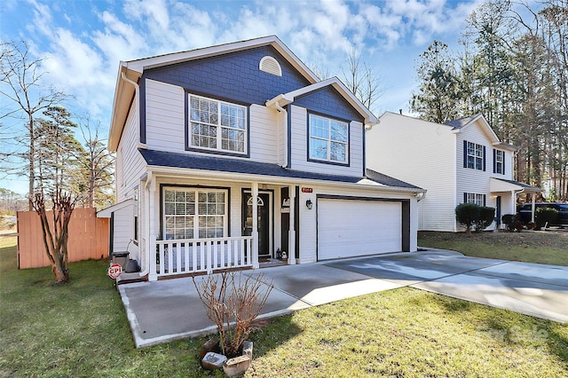 view of front of home featuring a porch, a garage, and a front lawn